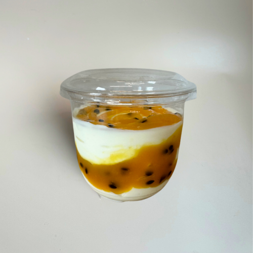 single package serving of greek yoghurt swirled with passionfruit