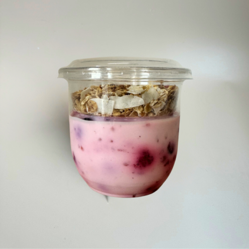 Single serve of packaged mixed berry yoghurt with granola