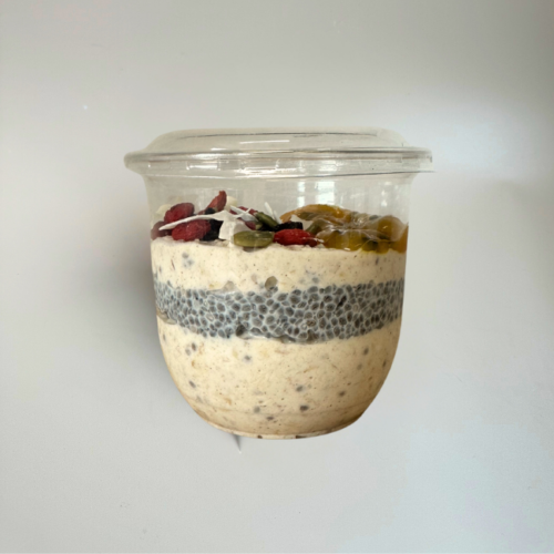 Packaged single serve Bircher muesli layered with chia pudding and topped with dried fruit and seeds